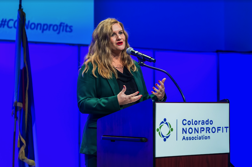 Elizabeth speaking at a conference